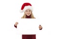 Little Christmas girl presenting. Adorable little girl holding a blank paper.