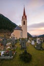 Little church with cemtery in the center of Racines at sunrise Royalty Free Stock Photo