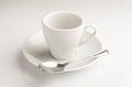 A little coffee cup with teaspoon in a white background