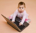 Little computer genius baby girl with laptop Royalty Free Stock Photo