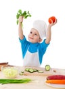 Little cook with parsley and tomatoes Royalty Free Stock Photo