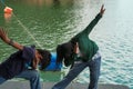 Little cool boy and girl dabbing while posing near the lake water