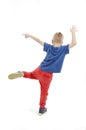 Little cool hip-hop boy in dance. Adorable boy dances. Rear view.