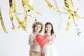 Little couple holding red heart Royalty Free Stock Photo