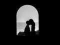 Little couple kissing silhouette in the tunnel Royalty Free Stock Photo