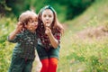 Little couple on Valentines Day. Enjoy Nature. Cute kids blowing dandelion. Kids walking in summer field.