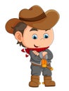 The little cowboy wearing the hat and standing cross the hand