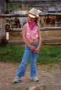 Little Cowgirl with Horse Corral Background Royalty Free Stock Photo