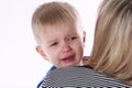 Little crying boy on moms shoulder Royalty Free Stock Photo