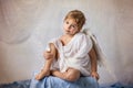 Little cupid toddle boy, holding bow and arrow, beautiful blond cherub Royalty Free Stock Photo