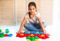 Little curious girl lays plastic puzzles