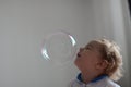 Girl playing with soap bubbles