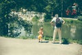 A little curly girl and her father are a close family.