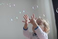 Girl playing with soap bubbles Royalty Free Stock Photo