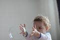 Girl playing with soap bubbles Royalty Free Stock Photo