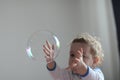 Girl playing with soap bubbles