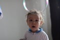 Girl playing with soap bubbles