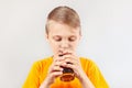 Little cut blonde boy drinking fresh cola Royalty Free Stock Photo