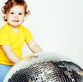 little cute adorable baby girl holding disco ball isolated on wh Royalty Free Stock Photo