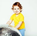 little cute adorable baby girl holding disco ball isolated on white close up, sweet real toddler, lifestyle people Royalty Free Stock Photo