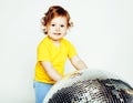 Little cute adorable baby girl holding disco ball isolated on white close up, sweet real toddler Royalty Free Stock Photo