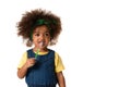 A little  african american girl brushing her teeth, isolated over white background with copyspace. Healthy teeth concept Royalty Free Stock Photo