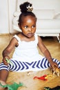 Little cute african american girl playing with animal toys at ho Royalty Free Stock Photo