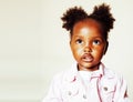 Little cute african american girl playing with animal toys at home, pretty adorable princess in interior happy smiling Royalty Free Stock Photo