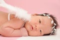 Little cute Asian girl baby with angel wing and beautiful headband with blank copyspace