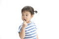 A little cute asian girl brushing her teeth isolated on white background. Royalty Free Stock Photo