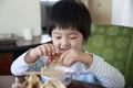 Little cute asian girl eating Royalty Free Stock Photo