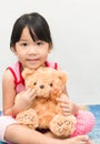 Little cute asian gril hug teddy bear Royalty Free Stock Photo