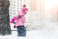 Little cute baby girl having fun on playground at winter. Children winter sport and leisure outdoor activities Royalty Free Stock Photo