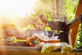 Little cute baby girl watching a book Science, education, knowl