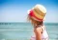 Little cute baby girl wearing hat on the beach Royalty Free Stock Photo