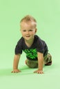 Little cute blond boy crawling, smiling Royalty Free Stock Photo