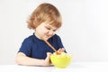 Little cute blonde boy refuses to eat cereal Royalty Free Stock Photo