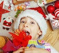 Little cute boy with Christmas gifts at home. close up emotional happy smiling in mess with toys, lifestyle holiday Royalty Free Stock Photo