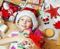 Little cute boy with Christmas gifts at home. close up emotional happy smiling in mess with toys, lifestyle holiday Royalty Free Stock Photo