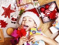 Little cute boy with Christmas gifts at home. close up emotional happy smiling in mess with toys, lifestyle holiday real Royalty Free Stock Photo