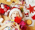 Little cute boy with Christmas gifts at home. close up emotional happy smiling in mess with toys, lifestyle holiday Royalty Free Stock Photo