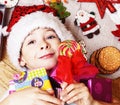 little cute boy with Christmas gifts at home. close up emotional happy smiling in mess with toys, lifestyle holiday real Royalty Free Stock Photo