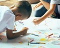 Little cute boy with company painting on birthday party Royalty Free Stock Photo