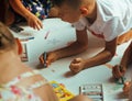 Little cute boy with company painting on birthday party Royalty Free Stock Photo