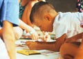 Little cute boy with company painting on birthday party Royalty Free Stock Photo