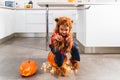 Little cute boy dressed as werewolf gesturing while scaring the camera during Halloween celebration