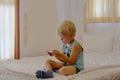 Boy playing video games on portable device Royalty Free Stock Photo