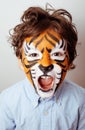 Little cute boy with faceart on birthday party close up, little cute tiger Royalty Free Stock Photo