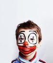 Little cute boy with facepaint like clown, pantomimic expression