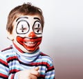 Little cute boy with facepaint like clown, pantomimic expression